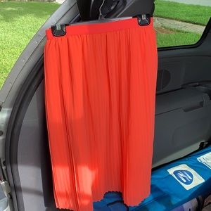 Orange pleated skirt